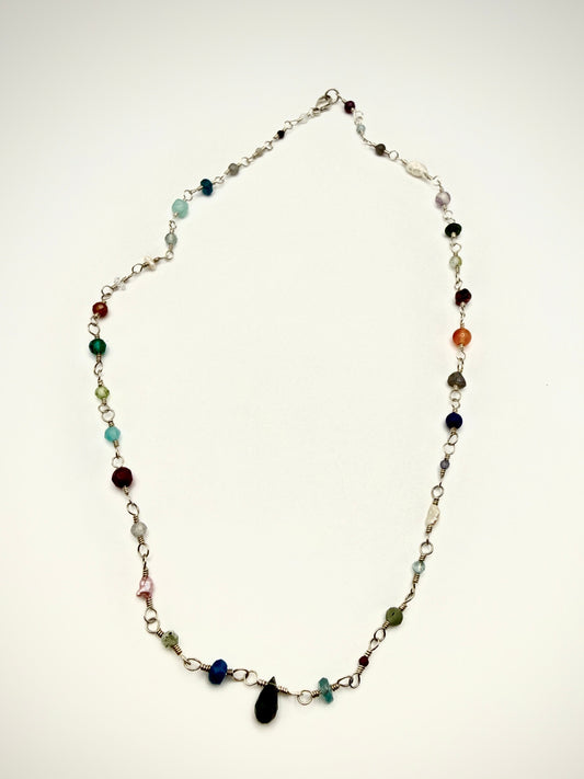 Necklace with multicolored beads on a white background